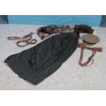 A collection of vintage clothing. Including leather police harness, University gown, fox stole,