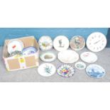 A box of assorted cabinet plates and garden wall ceramic clock etc.