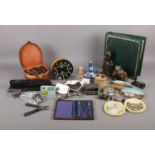 A box of assorted collectables. To include a leather collar box, large collection of coat buttons,