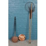 A copper plate with bedpan and landing net on bamboo rod. Bedpan L: 106cm.