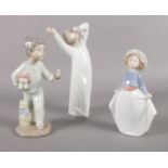 Three Lladro/Nao figurines. Tallest 22cm height.