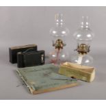 A quantity of miscellaneous. A pair of vintage oil lamps, The Swift hair clipper No 80a (boxed),