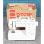 A boxed Brother 1097 sewing machine, with protective cover.