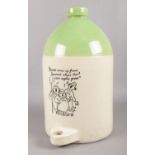 A large stoneware apple cider flagon. Decoration to the front and rear. H: 39cm. No stopper.