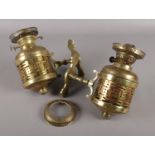 A pair of wall mounting brass oil lamps.