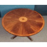 A walnut fan patera circular dining table. with tripod pedestal base (146cm diameter 70cm height)