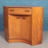 A teak G Plan concave desk secretaire. (84cm x 95cm)