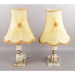 A pair of Onyx table lamps, with frilled shades. Plug has been cut off one of the cables.