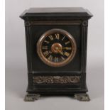 A French slate mantel clock. With brass mounted decoration. 33cm x 24cm