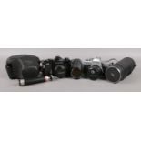 A selection of cameras and lenses. To include a Minolta SRT101, fitted with a Makinon 24mm lens,