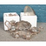 Two boxes of silver plated wares. Teapot, coffee pot, serving trays etc