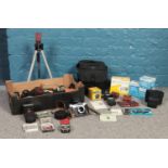 A box of photographic equipment and accessories. To include three boxed Minolta lenses, Hoya
