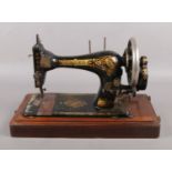 A mahogany cased Singer sewing machine.