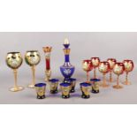 A collection of Venetian hand painted and gilt glassware.