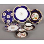 A quantity of ornate display plates and saucers. Including Worchester, Dresden, etc.