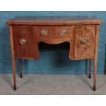 An early 19th Century mahogany bowfront sideboard. Raised on slender tapering legs. (88cm x 107cm)