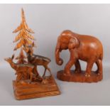 A quantity of wooden figures. Carved African elephant (33cm height) & a carved desk stand, with deer