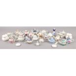 A collection of miniature ceramics; mainly teapots produced by Porcelain Art.