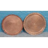 Two large circular copper serving trays/occasional table tops. One stamped Alla Monda.