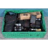 A box of photographic equipment. Includes several cameras, including Olympus 840, tripods and a