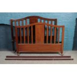 An Edwardian mahogany three part bedroom suite. Includes chest of drawers, dressing table and double
