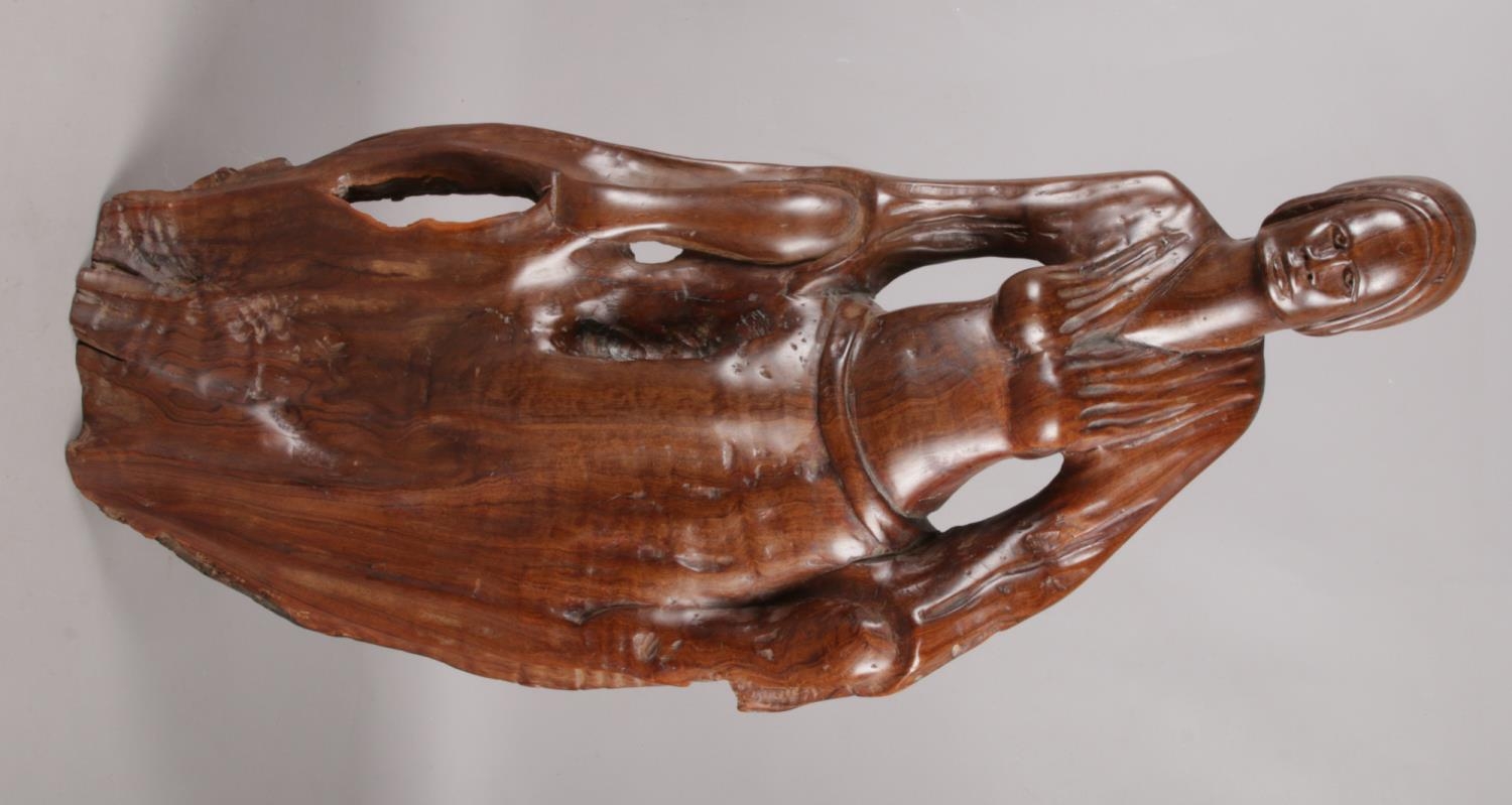 A large African hardwood carving. Formed as a woman. (67cm)