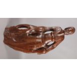 A large African hardwood carving. Formed as a woman. (67cm)
