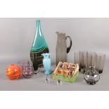 A quantity of glassware. White friars style jug, decorative vase, vintage boxed shot glasses etc