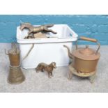 A box of assorted metal wares. Vintage brass kettle, brass trivet, brass dog figure etc