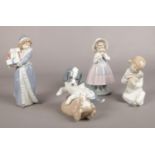 Four Nao by Lladro figurines.