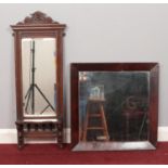 Two wall mirrors. To include an Edwardian carved mahogany mirror with shelf and a square rosewood