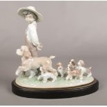 A Lladro figure. No 6828 'My little explorers'. 26.5cm height. Good condition.