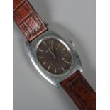 A gents Longines stainless steel manual wristwatch on leather strap. With black dial and baton