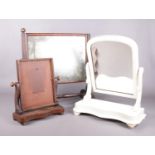 Three mahogany swing dressing table mirrors. To include a Victorian white painted mirror and a
