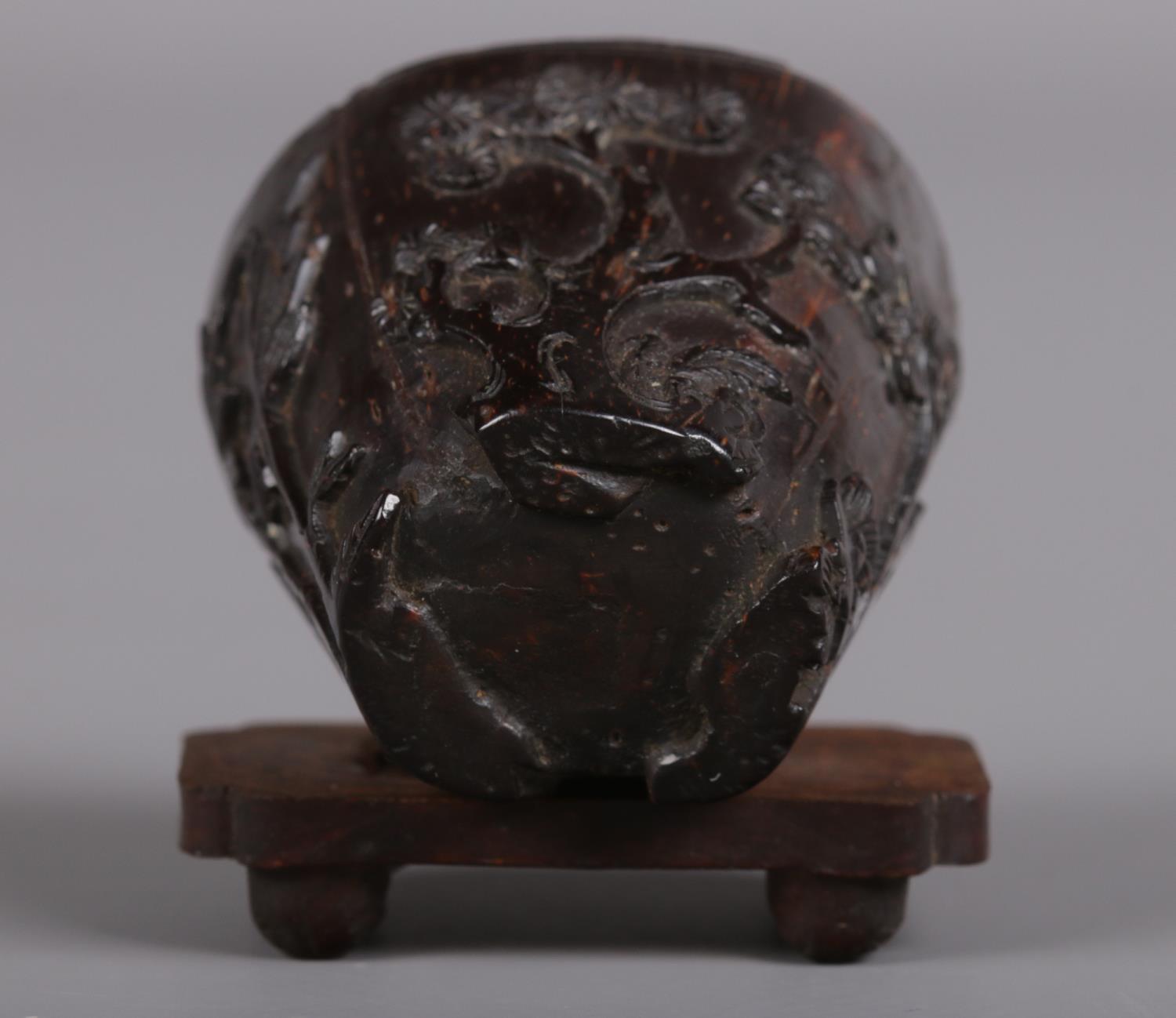 A miniature Chinese libation cup, possibly 18th century. Carved from a seed or nut and decorated - Image 4 of 7