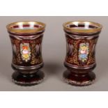A pair of ruby and clear glass vases with gilt and floral decoration. 13cm.