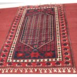 A Red & blue wool Aztec rug.110cm x 189cm