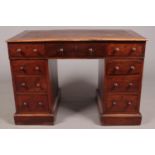 A Victorian mahogany twin pedestal desk with leather inset top.