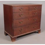 A George III oak chest of drawers. Height 88.5cm Width 98cm Depth 50.5cm.