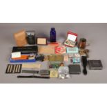 A box of assorted collectables. To include a Wyeth Colbalt blue bottle, a copper and brass