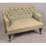 A small button-backed two seater upholstered sofa. Comprising of turned mahogany legs and Shephard