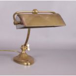 A vintage brass desk lamp.