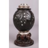 A George IV silver mounted coconut and treen tea caddy with carved decoration and mother of pearl