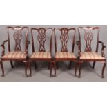 A set of eight mahogany dining chairs, with lattice back splat and pink and cream floral fabric seat