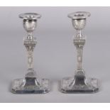 A pair of early 20th century silver candlesticks of Neoclassical design. Assayed Sheffield 1910 by