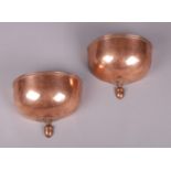 A pair of art deco copper wall lights.