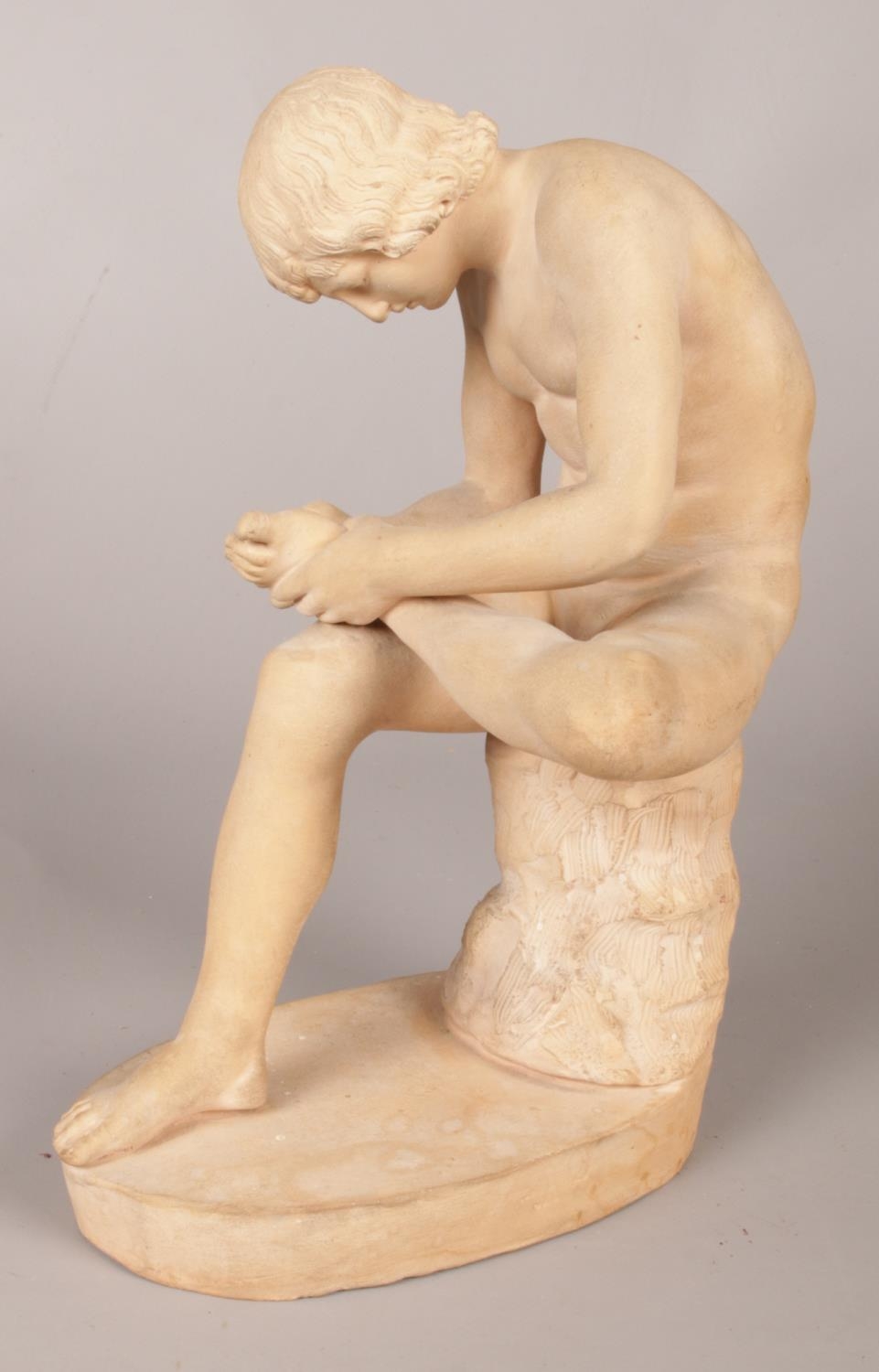 After antiquity, a terracotta sculpture of Spinario/Boy with Thorn. 23.5cm.
