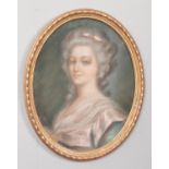 A pastel portrait of a maiden, in gilt oval frame.