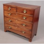 A George III mahogany chest of drawers. Height 98cm, Width 105cm, Depth 49cm. Generally good for