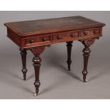 A Mahogany ladies writing desk stamped W Fry & Co 7733. Comprising of three drawers, leather